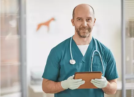 male doctor with tablet